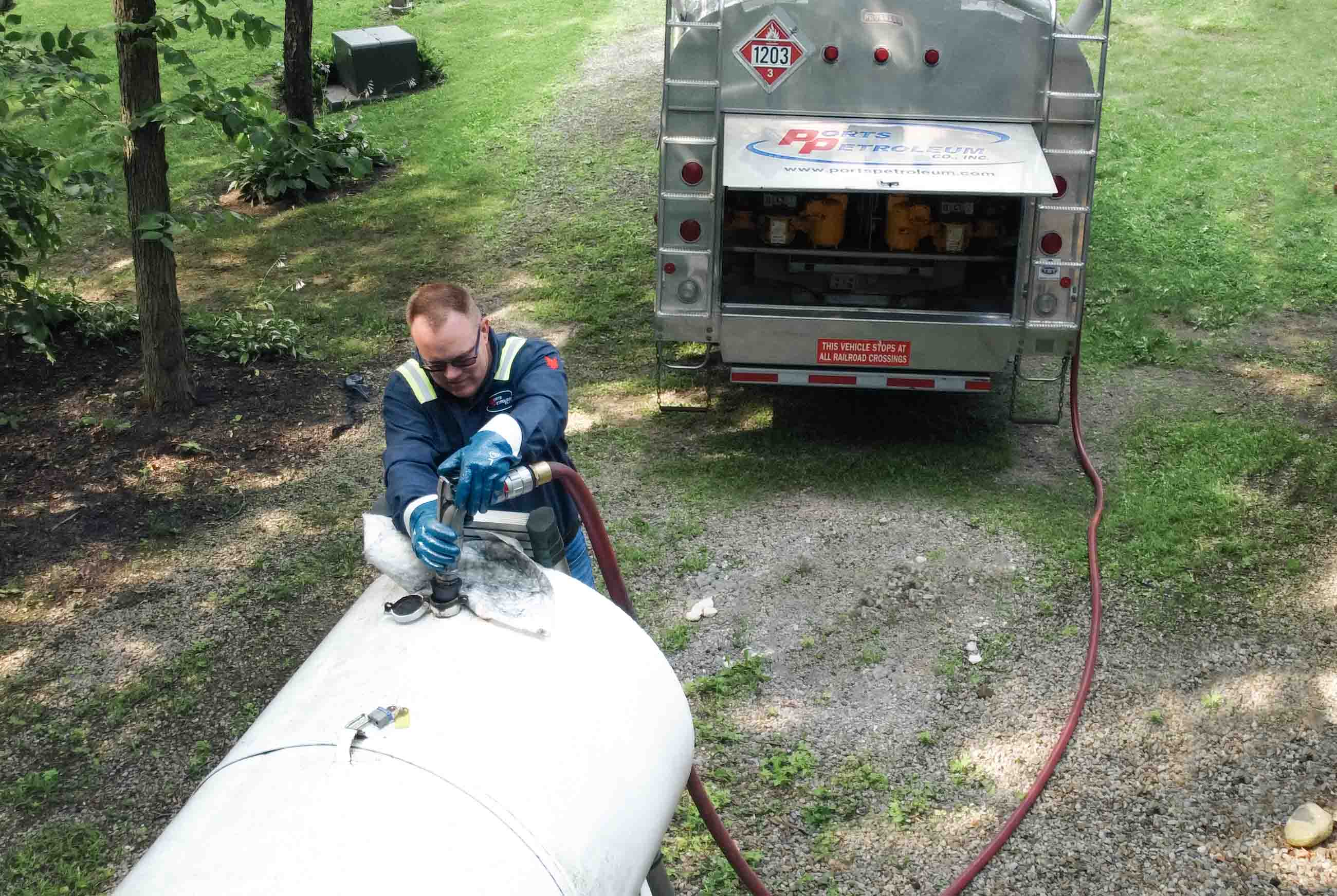 Truck Driver filling home tank