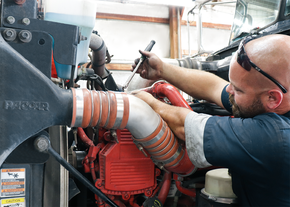 Modern Ports Petroleum mechanic working on fuel truck