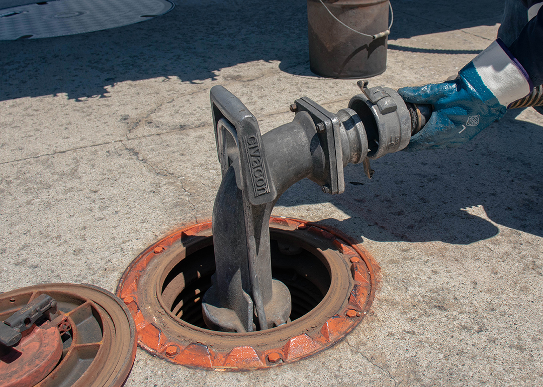 Fuel Truck Driver filling an underground storage tank.